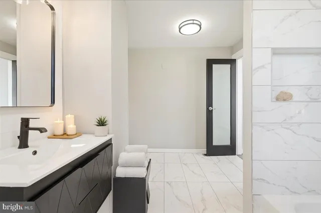 a bathroom with a sink and a mirror