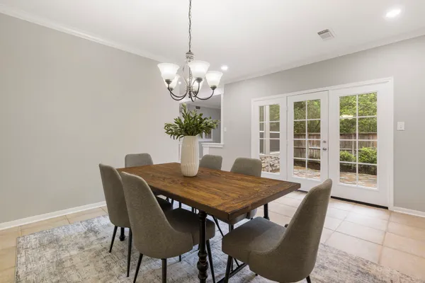 a view of entryway and hall with a potted plant