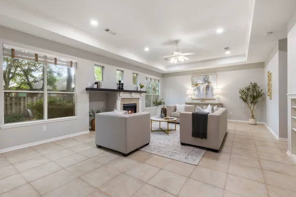 a living room with furniture and a fireplace