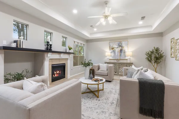 a living room with furniture and a fireplace