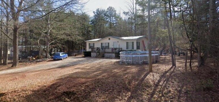 213 Exeter Court Anderson, SC 29621 - Photo 1 of 1 A private wooded setting surrounds this charming modular home with an above-ground pool.