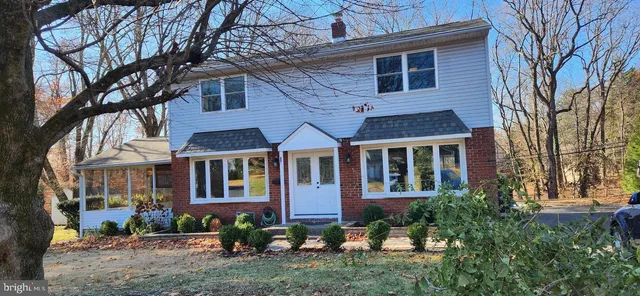 a view of a brick building next to a yard