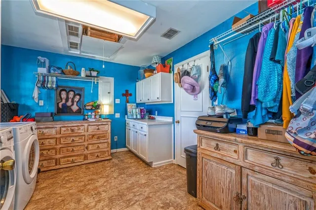 a view of a kitchen with storage and utility