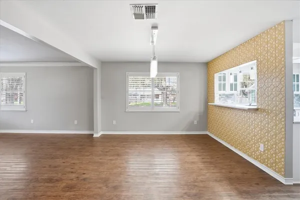 a view of a swimming pool with a yard