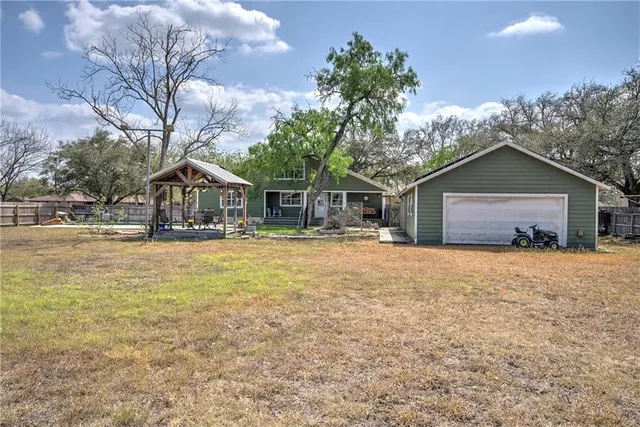 a house with trees in front of it