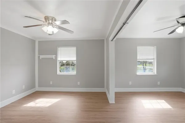 a view of an empty room with a window