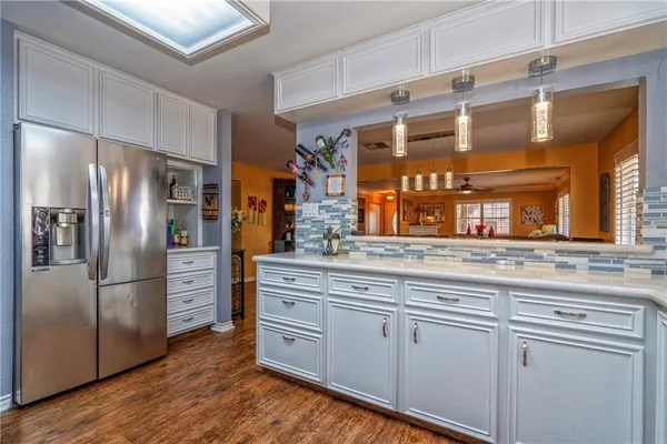 a kitchen with a sink cabinets and window