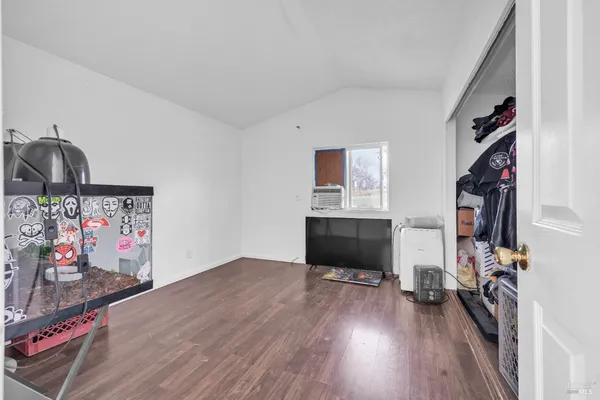 a view of a livingroom with wooden floor and a couch