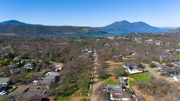 a view of a town with mountains in the background
