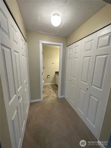 a view of a bathroom from a hallway