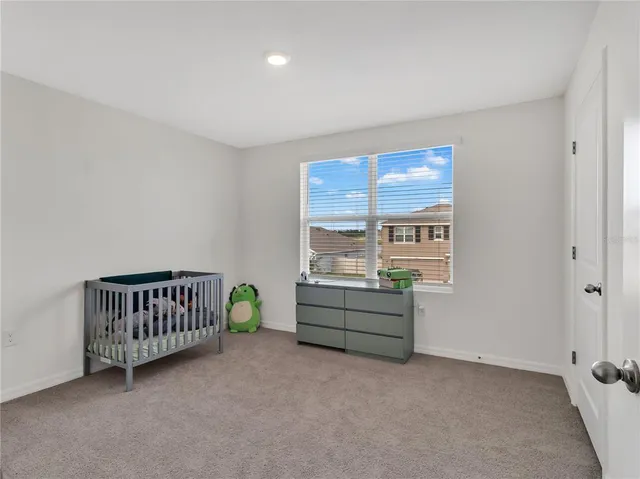 a house with green field in front of it
