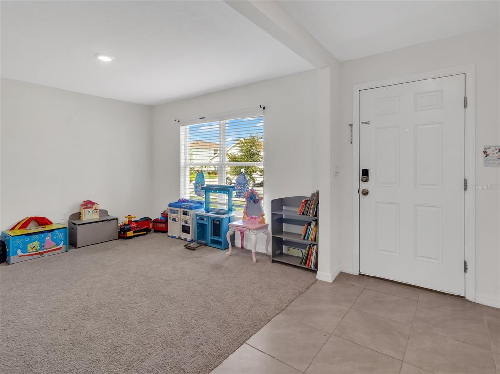 16669 Windmill Forge Pass Wimauma, FL 33598 - Photo 3 of 44 a view of room with toys