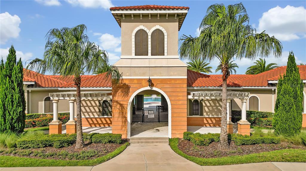 16669 Windmill Forge Pass Wimauma, FL 33598 - Photo 33 of 44 a front view of a house with a garden
