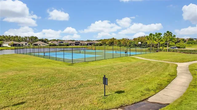 a view of swimming pool with outdoor seating and plants