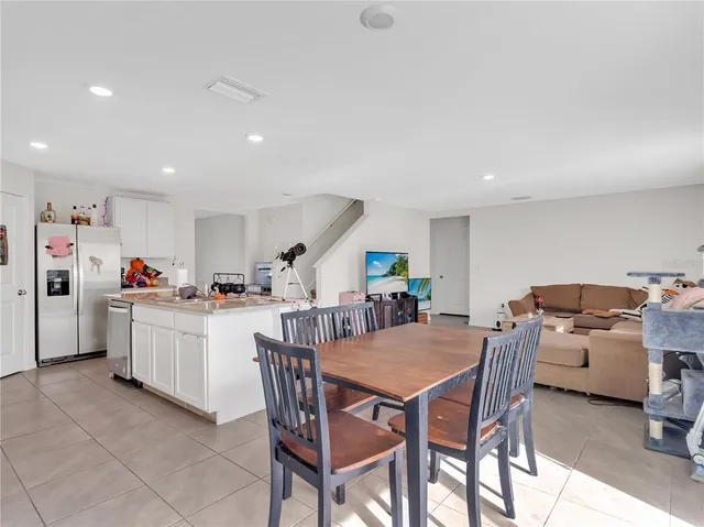 a kitchen with a sink and appliances