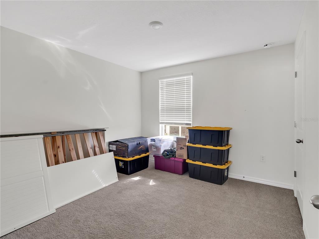 16669 Windmill Forge Pass Wimauma, FL 33598 - Photo 7 of 44 a bedroom with furniture and window