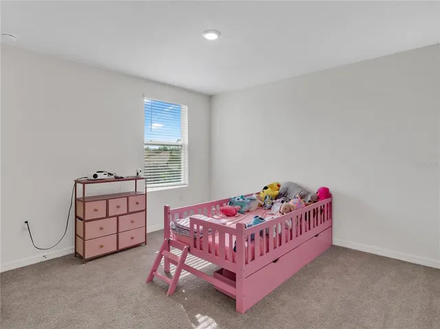 a kitchen with stainless steel appliances granite countertop a sink and a refrigerator