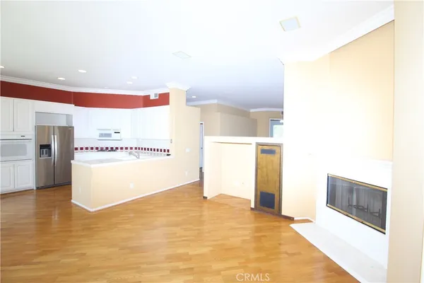 a view of a kitchen with a refrigerator