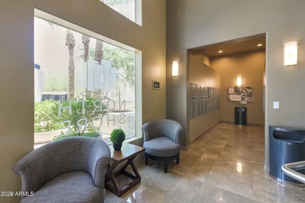 a living room with furniture and a large window