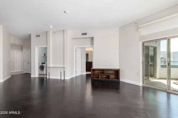 a view of a livingroom with furniture and hardwood floor