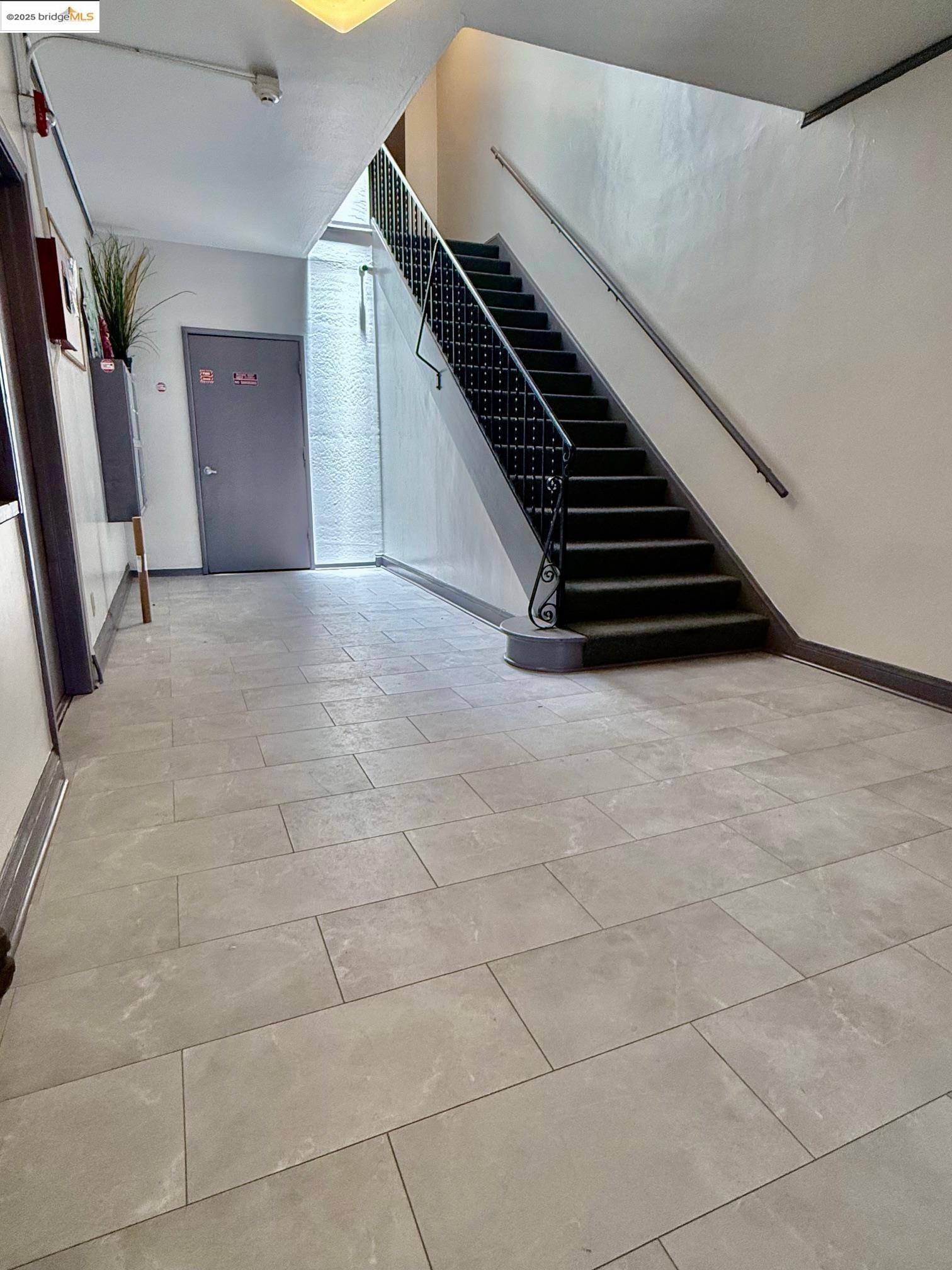 2240 MacArthur Boulevard Oakland, CA 94602 - Photo 12 of 13 Stairway featuring baseboards