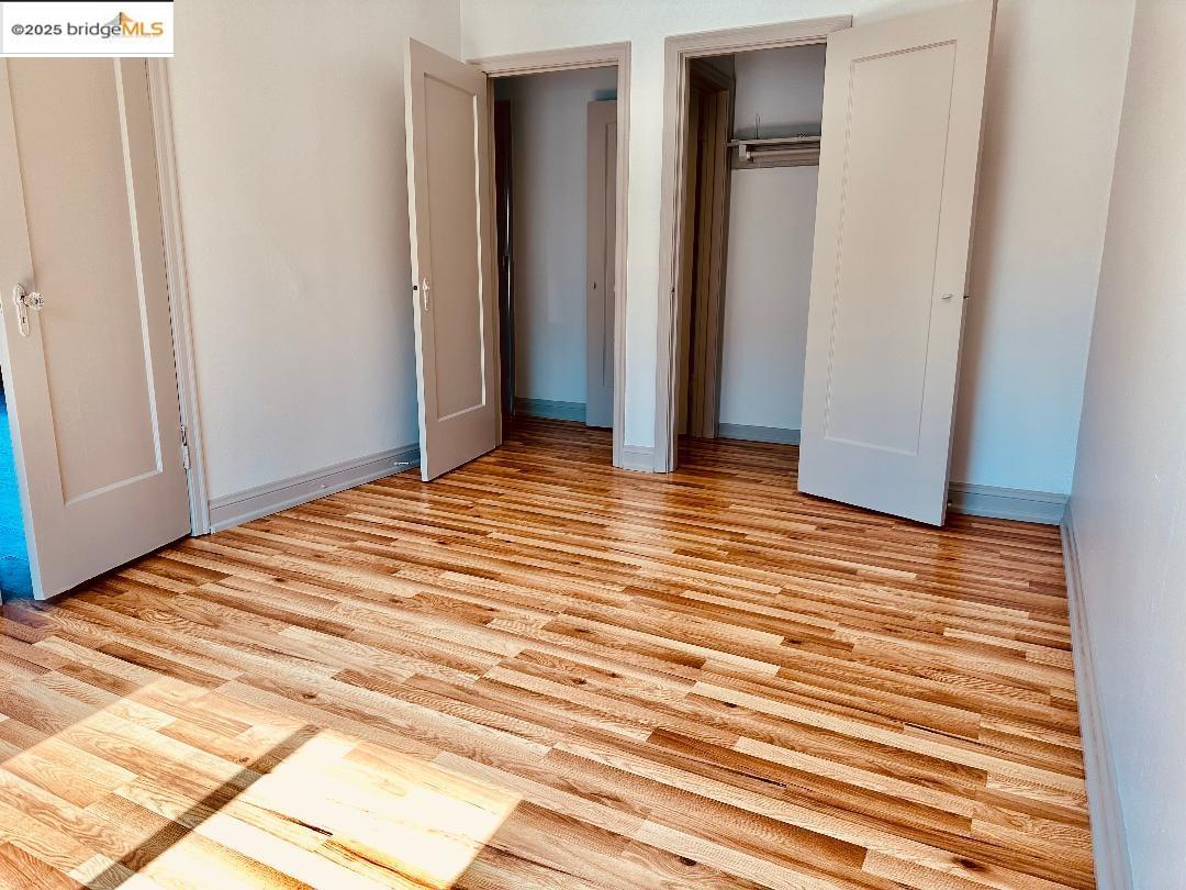 2240 MacArthur Boulevard Oakland, CA 94602 - Photo 8 of 13 Unfurnished bedroom featuring light wood-type flooring and a closet