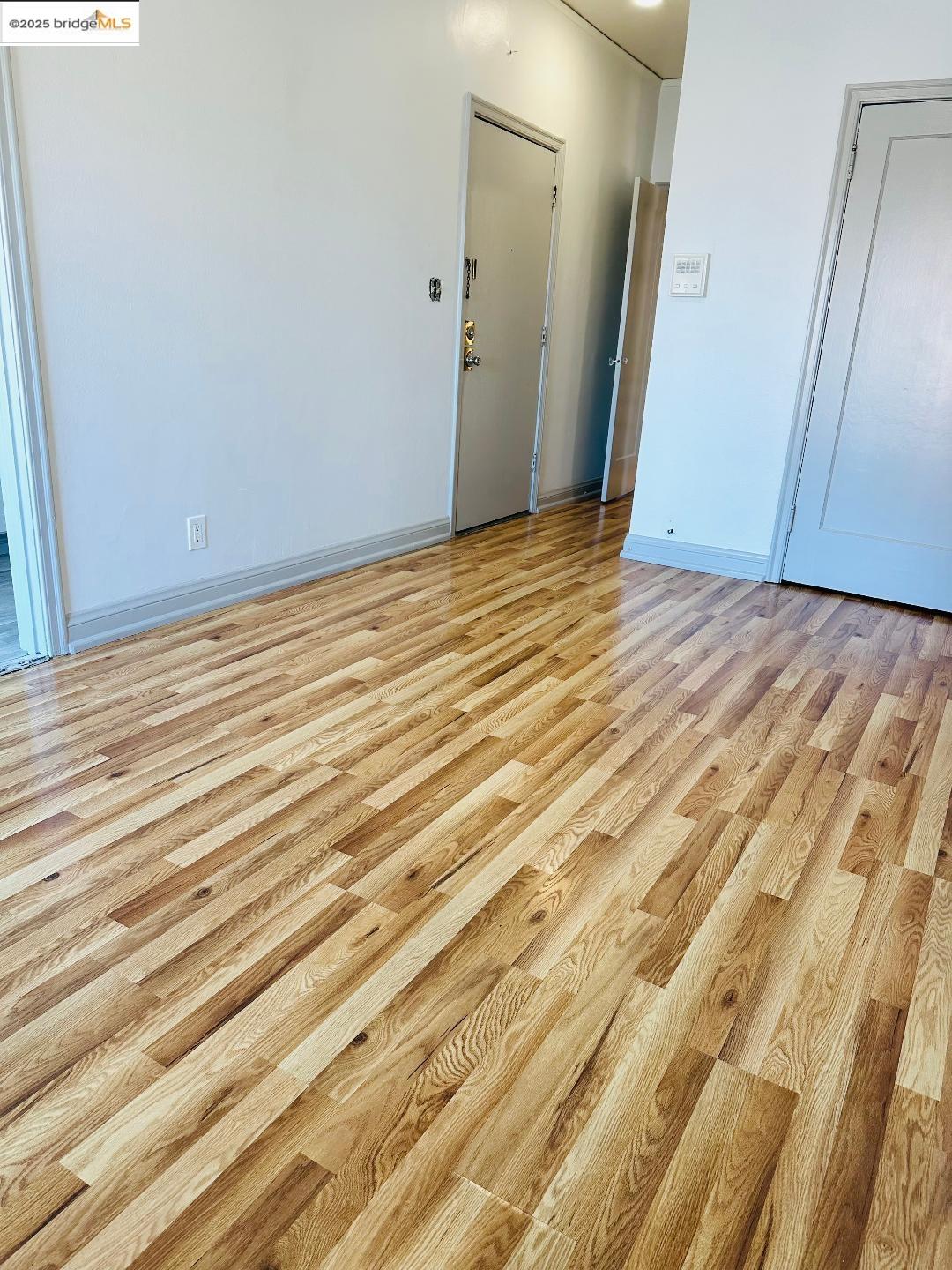 2240 MacArthur Boulevard Oakland, CA 94602 - Photo 10 of 13 Spare room with light wood-style flooring and baseboards