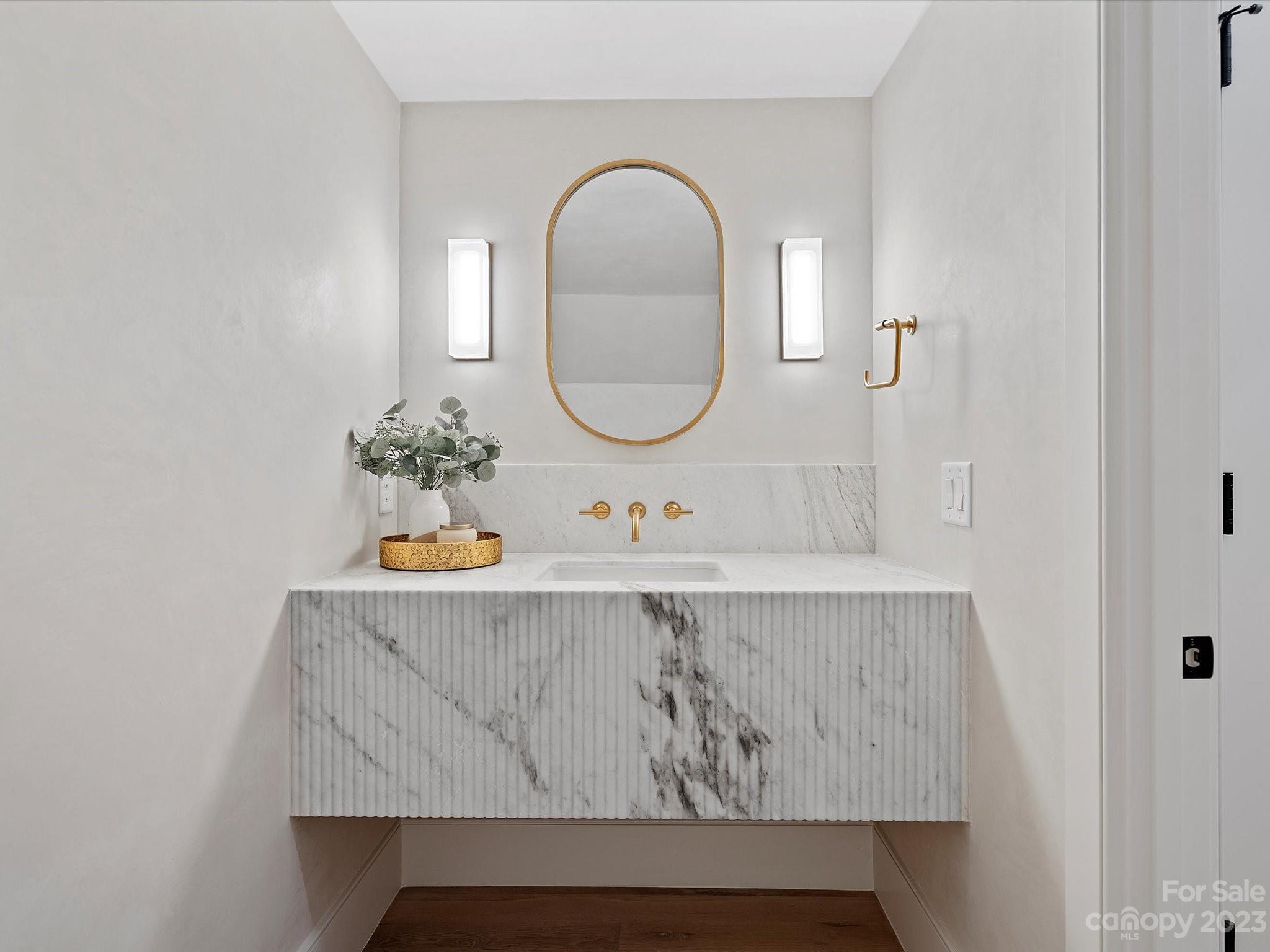 3272 Foxcroft Road Charlotte, NC 28211 - Photo 20 of 42 a bathroom with a sink and a mirror