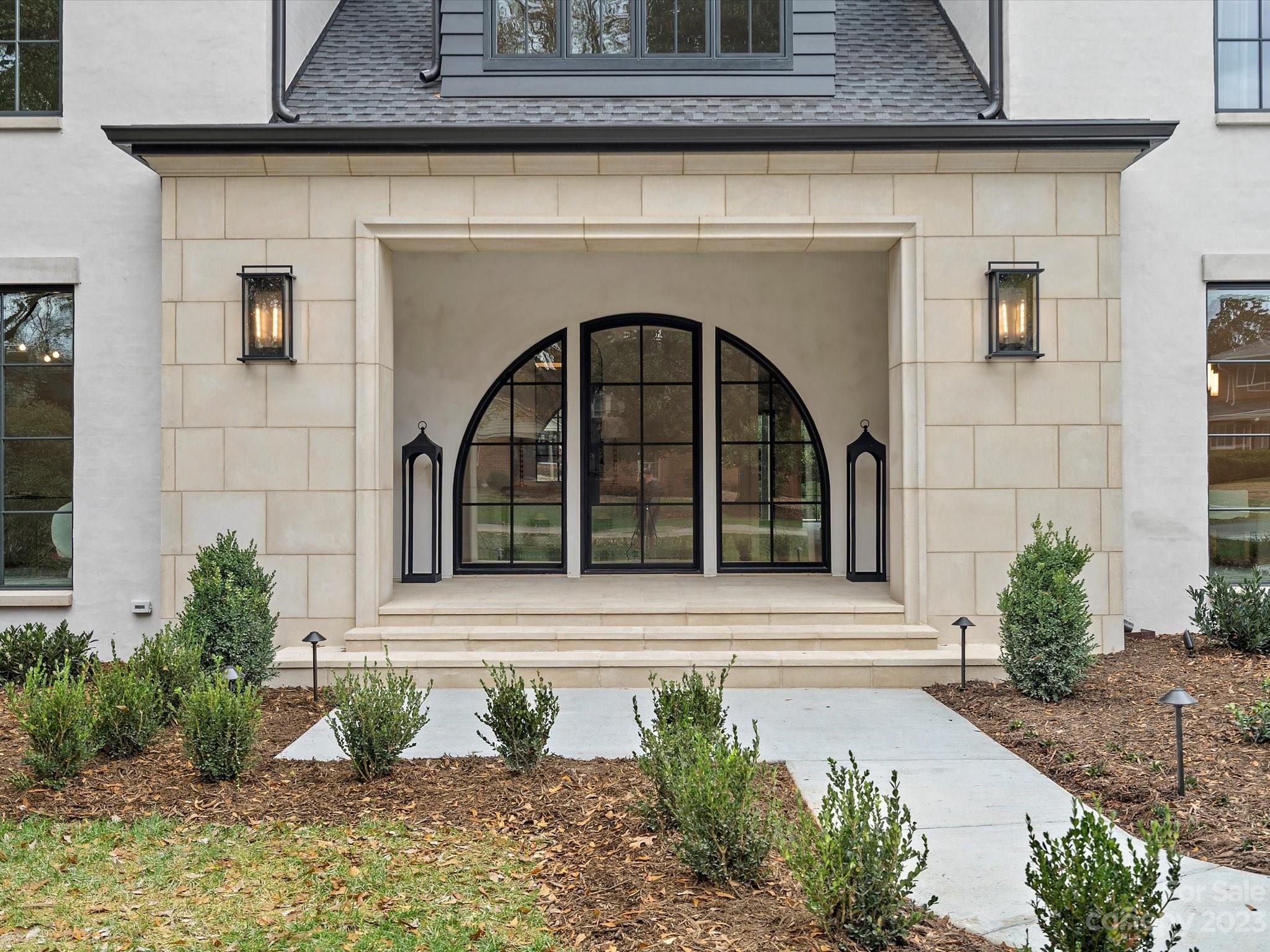 3272 Foxcroft Road Charlotte, NC 28211 - Photo 2 of 42 a front view of a house with garden