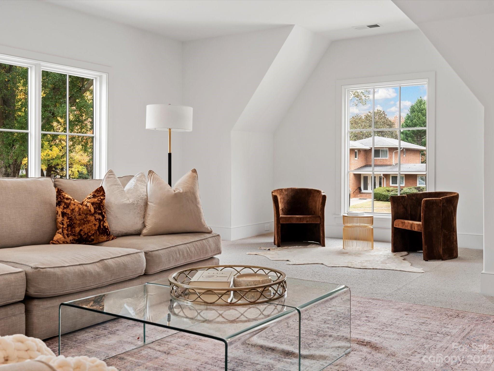 3272 Foxcroft Road Charlotte, NC 28211 - Photo 36 of 42 a living room with furniture wooden floor and a window