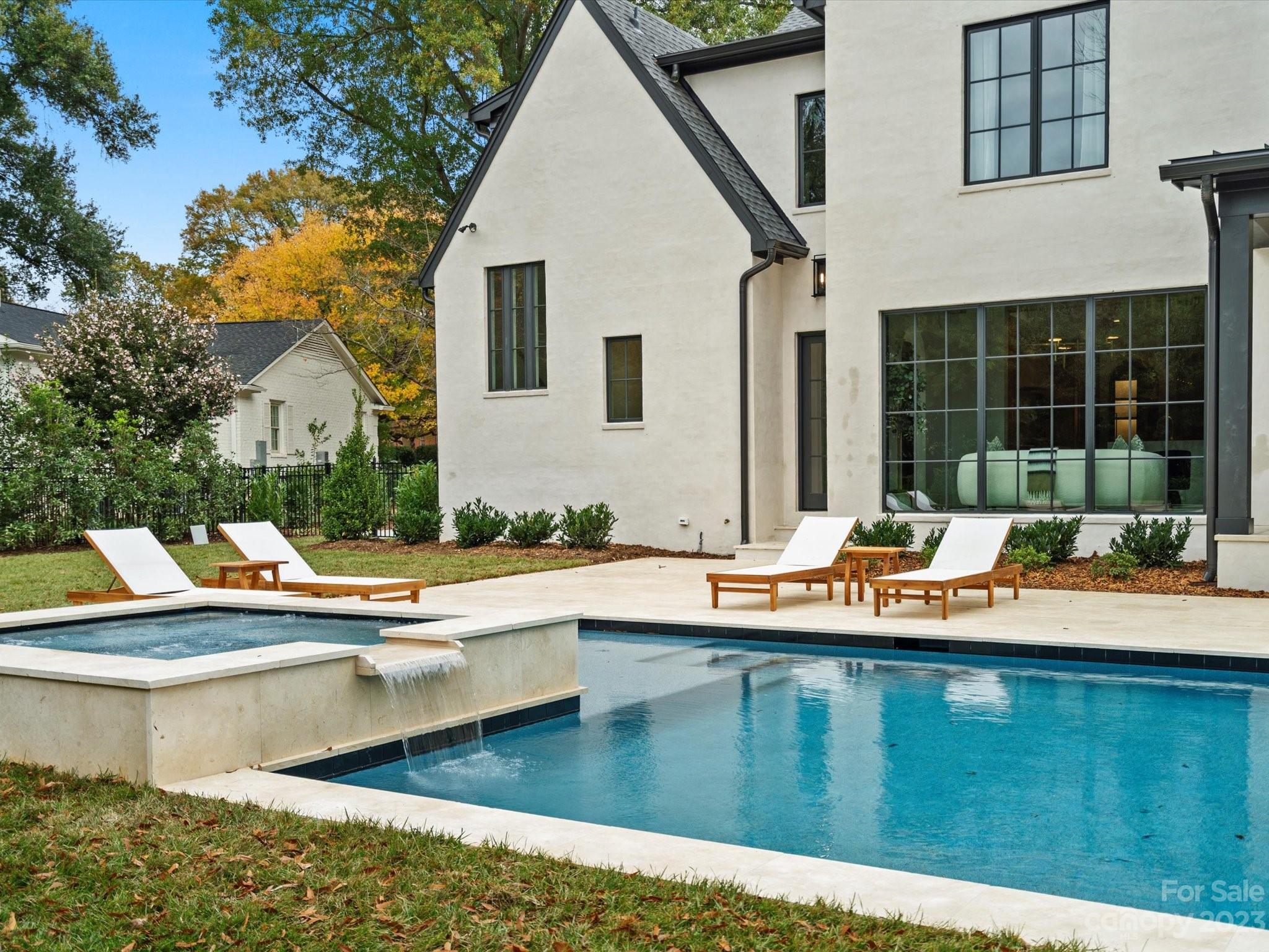3272 Foxcroft Road Charlotte, NC 28211 - Photo 41 of 42 a view of a house with pool and chairs