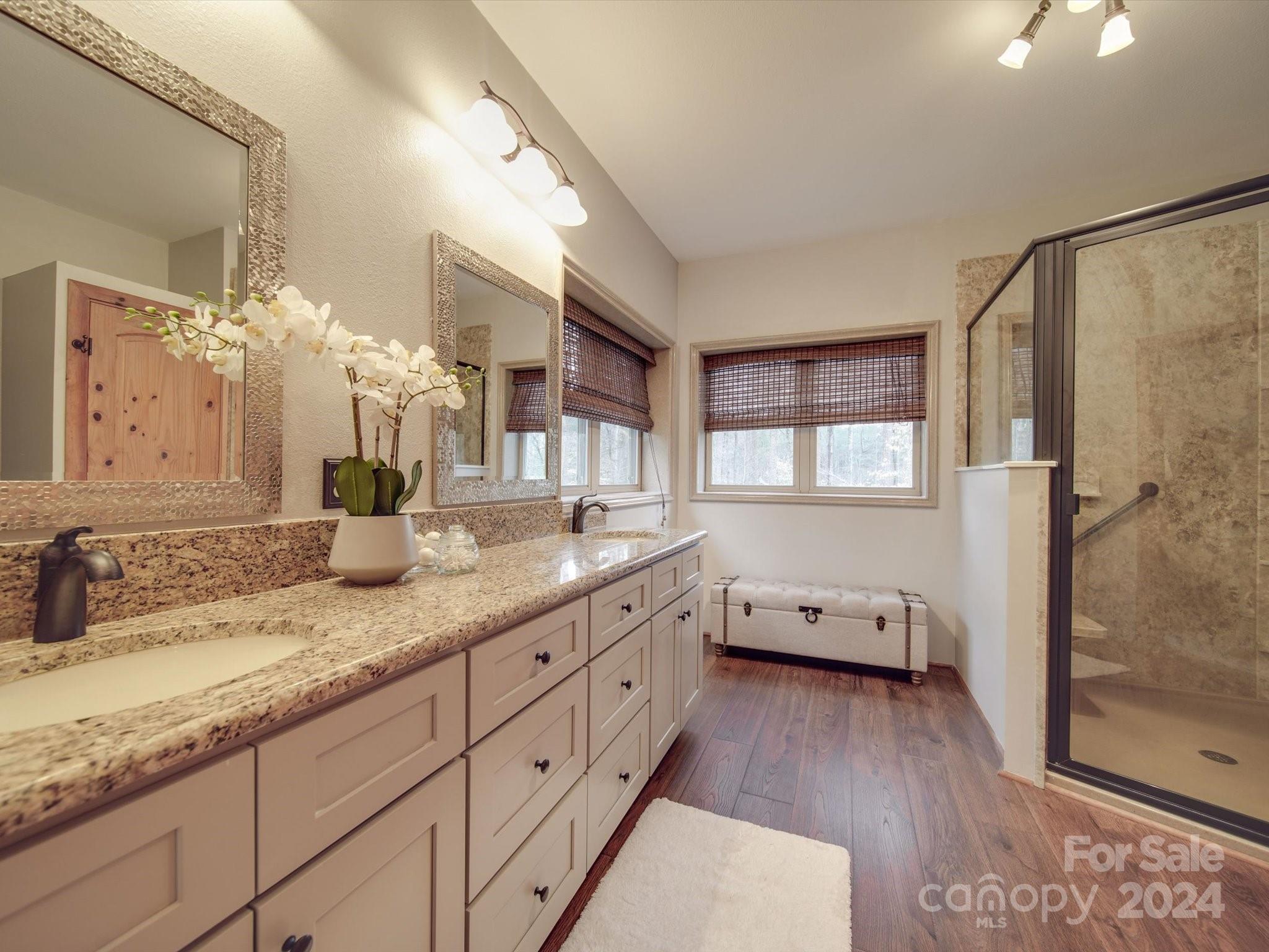 1220 Bridges Acres Road Kannapolis, NC 28083 - Photo 11 of 46 a bathroom with a granite countertop double vanity sink a mirror and a shower