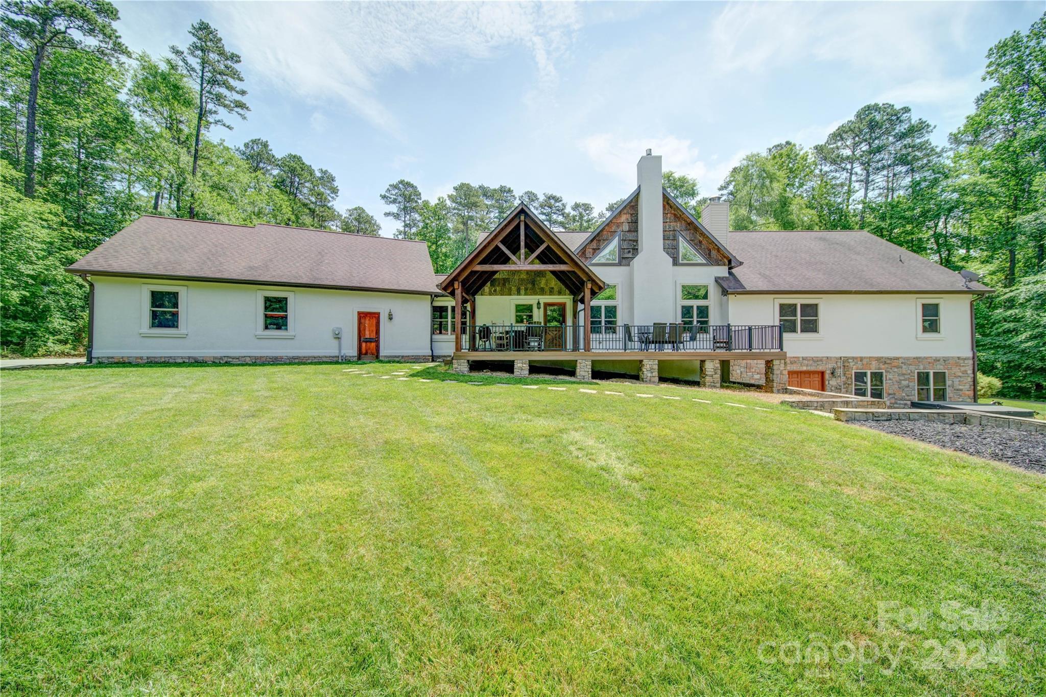 1220 Bridges Acres Road Kannapolis, NC 28083 - Photo 28 of 46 a front view of a house with a garden and trees