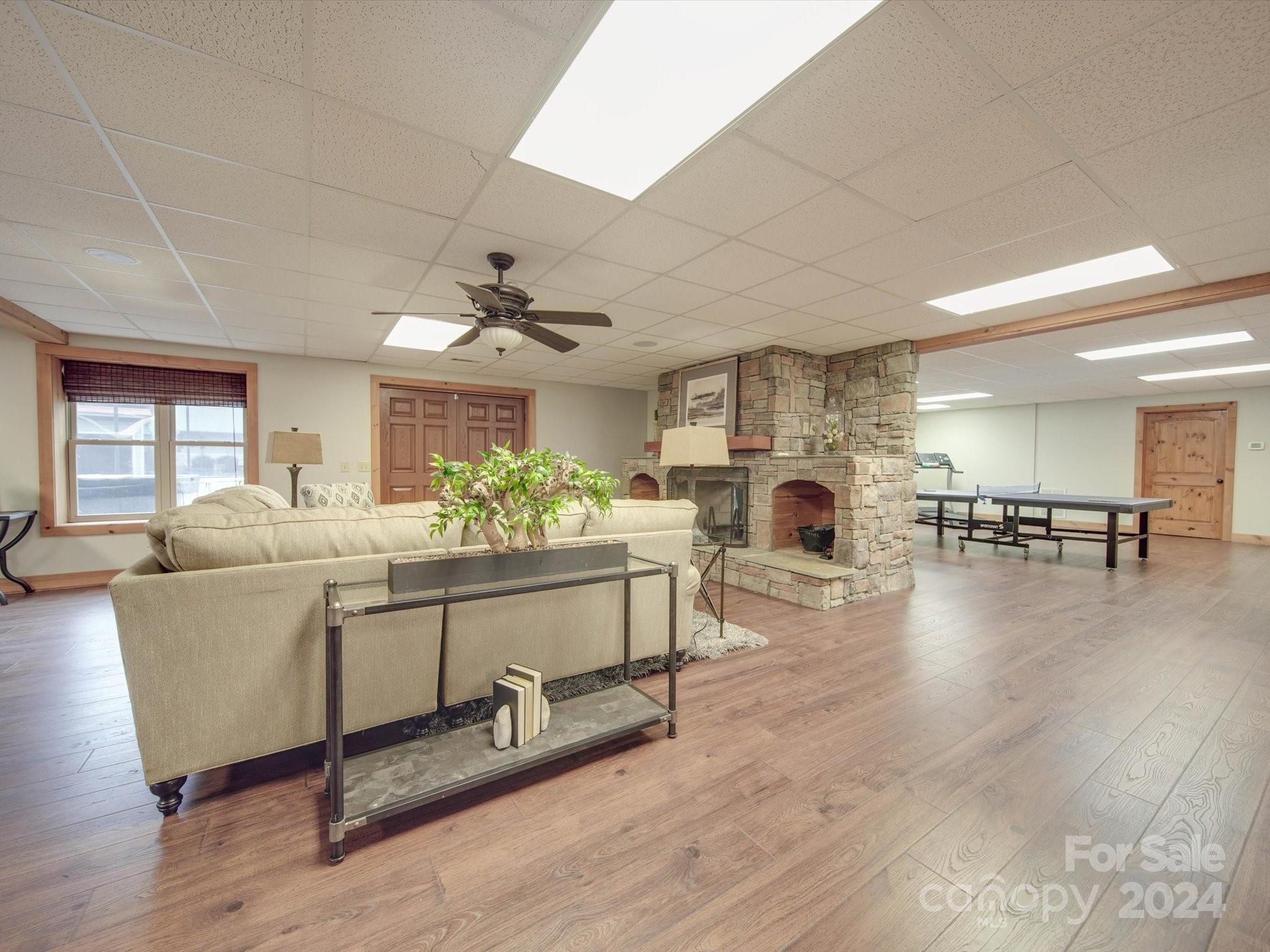 1220 Bridges Acres Road Kannapolis, NC 28083 - Photo 33 of 46 a living room with furniture a fireplace and wooden floor