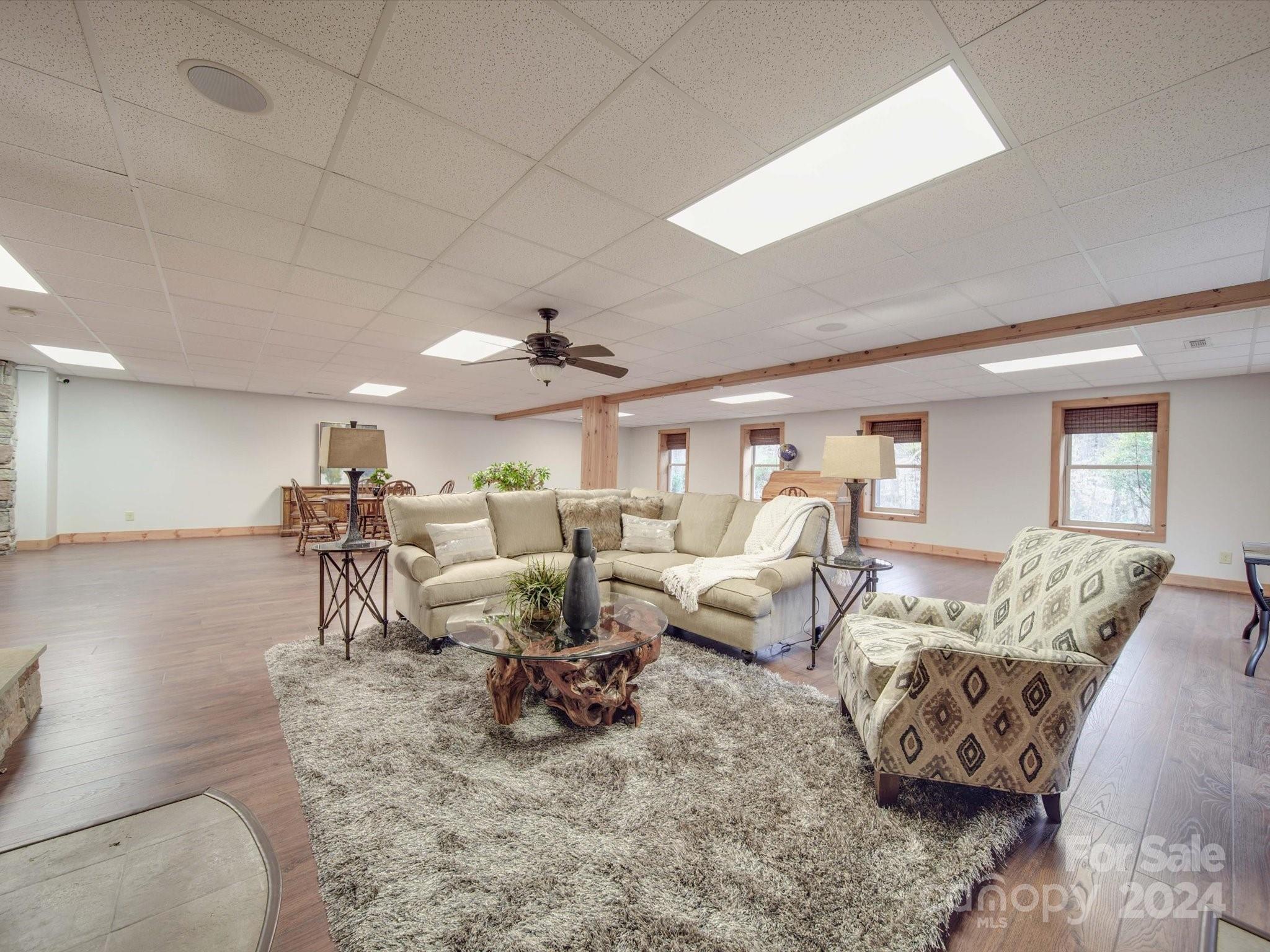 1220 Bridges Acres Road Kannapolis, NC 28083 - Photo 34 of 46 a living room with furniture and a chandelier