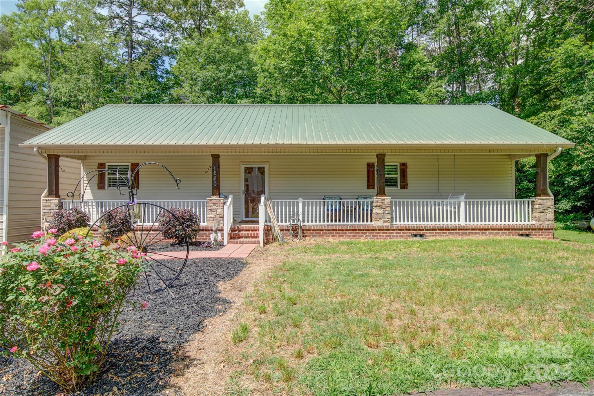 1220 Bridges Acres Road Kannapolis, NC 28083 - Photo 39 of 46 a backyard of a house with yard and outdoor seating