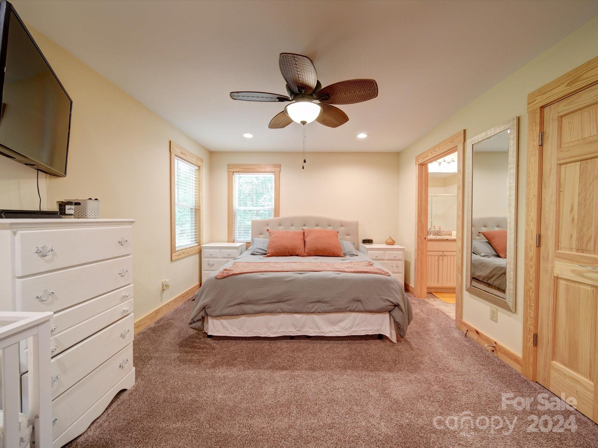 1220 Bridges Acres Road Kannapolis, NC 28083 - Photo 42 of 46 a spacious bedroom with a bed and a flat screen tv