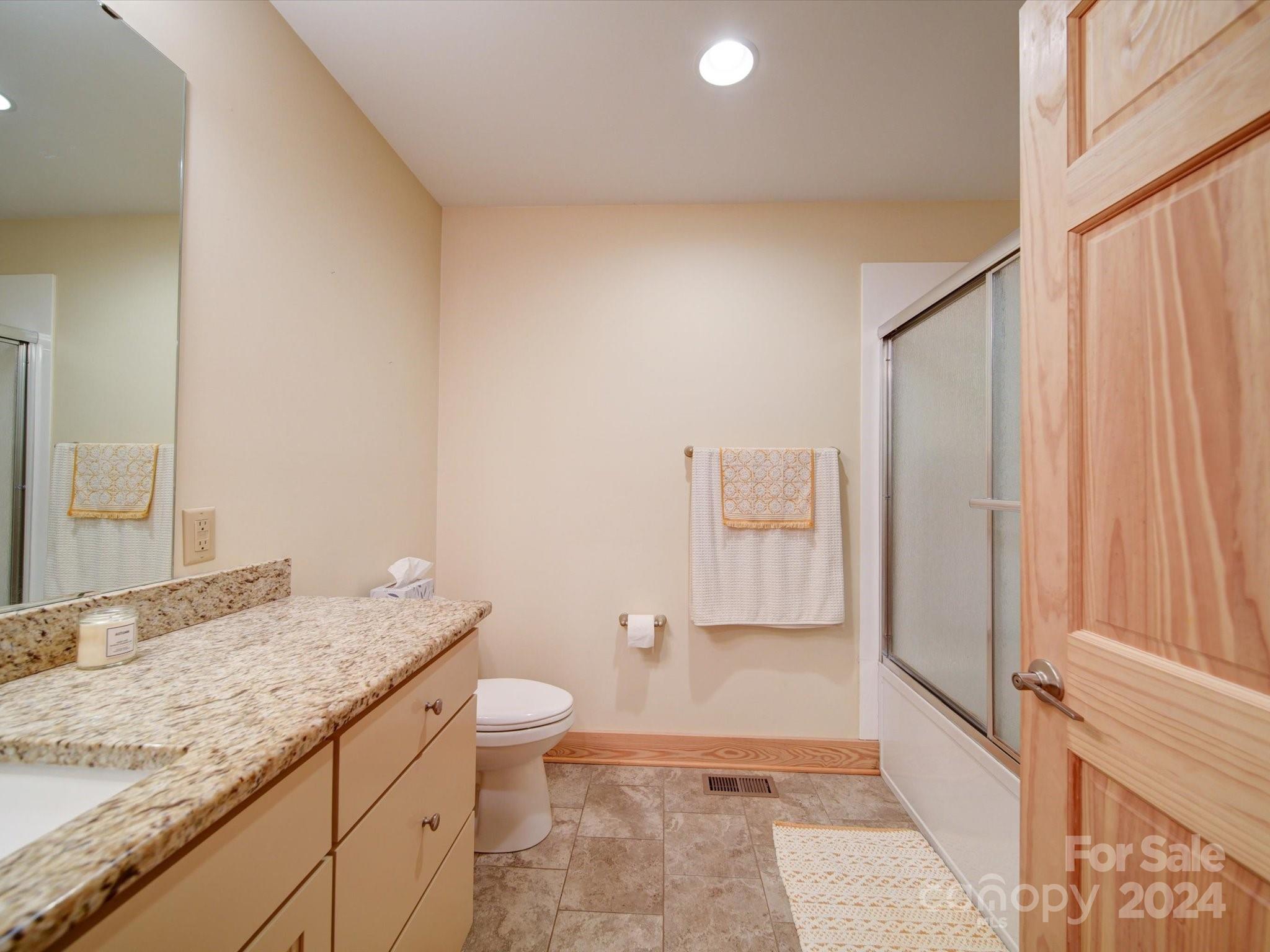1220 Bridges Acres Road Kannapolis, NC 28083 - Photo 44 of 46 a bathroom with a granite countertop sink and a mirror