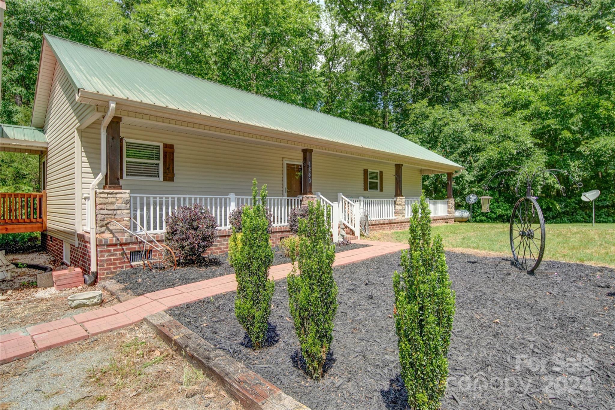 1220 Bridges Acres Road Kannapolis, NC 28083 - Photo 45 of 46 a front view of a house with garden