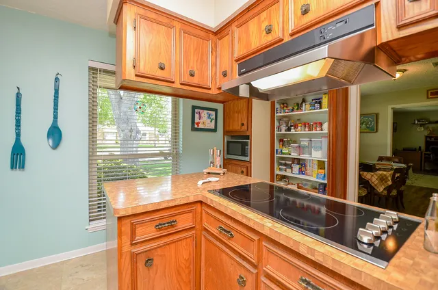 a kitchen that has a sink and a window