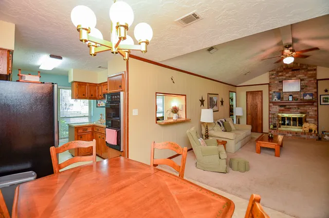 a bedroom with furniture and a chandelier