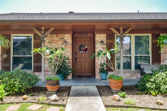 a front view of house with outdoor seating