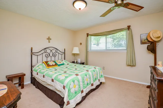 a bedroom with a bed and window