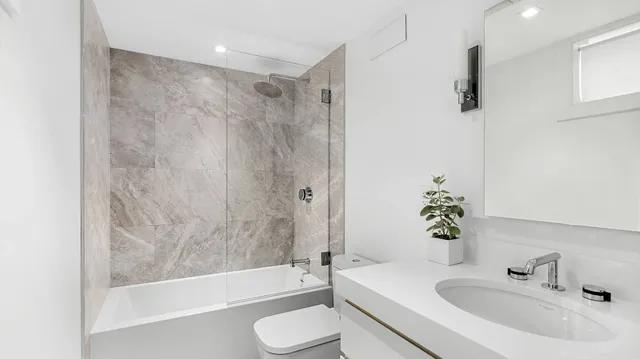 a bathroom with a sink a toilet and a bathtub