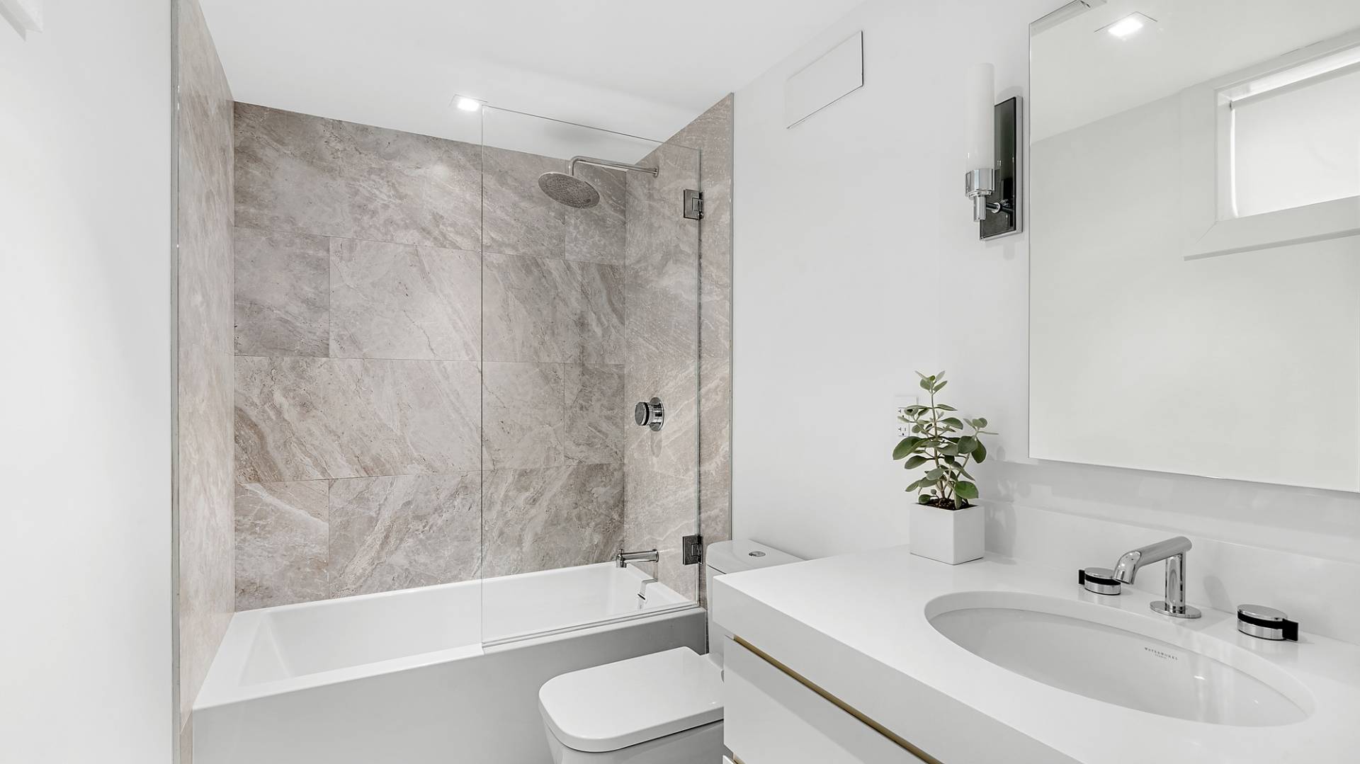 8 Patriots Lane East Hampton, NY 11937 - Photo 16 of 23 a bathroom with a sink a toilet and a bathtub