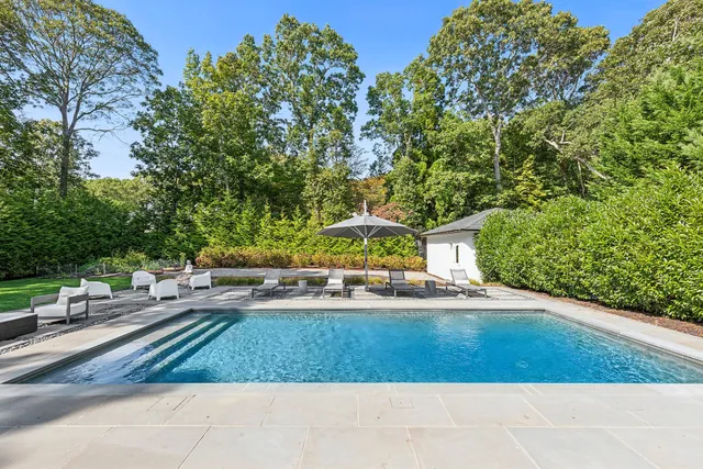 a view of a yard with table and chairs