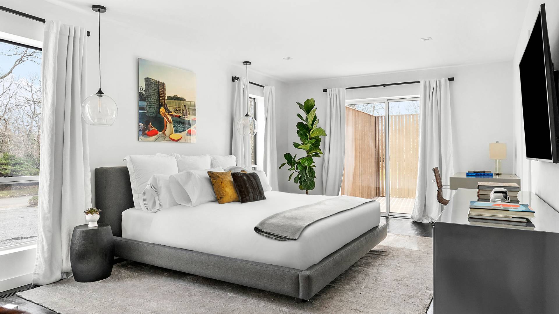 8 Patriots Lane East Hampton, NY 11937 - Photo 10 of 23 a bedroom with a bed and a flat screen tv