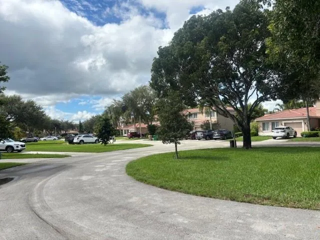 a view of a house with a backyard