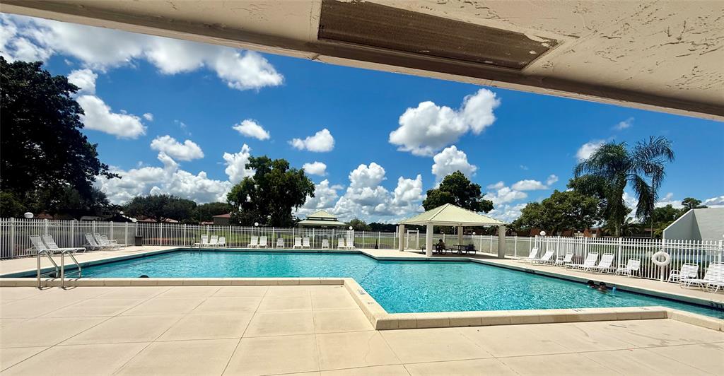 1654 Southwest 109th Terrace Davie, FL 33324 - Photo 22 of 24 a view of swimming pool with outdoor seating