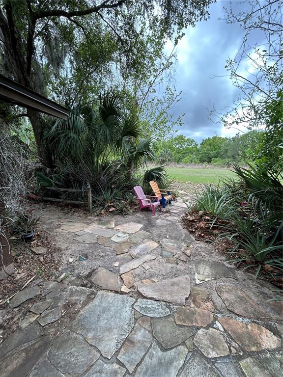 10679 Goose Prairie Road Leesburg, FL 34788 - Photo 10 of 30 a view of outdoor space with garden view